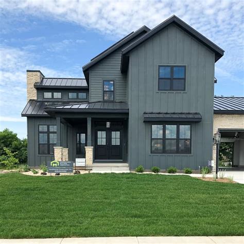 green siding with black trim